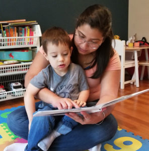 Au Pair reading to a child.