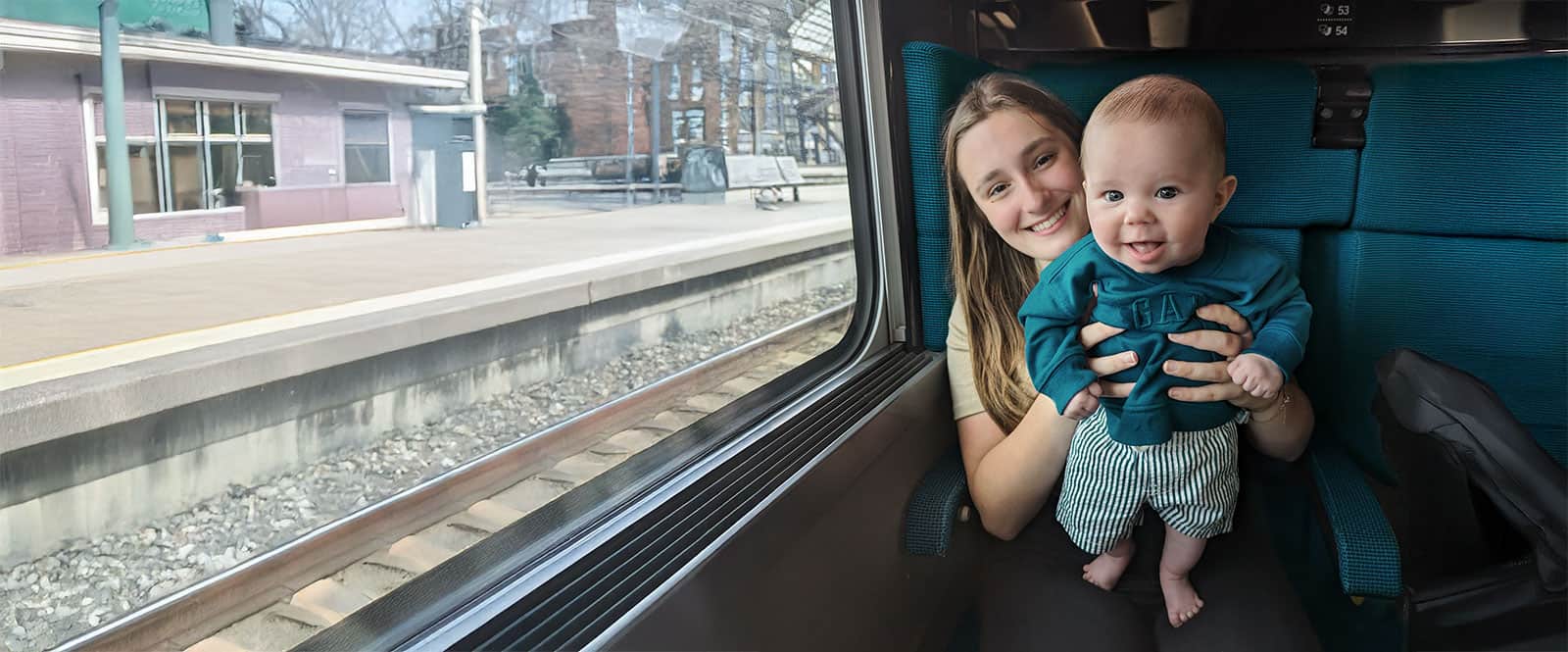 Au pair and infant on a train.