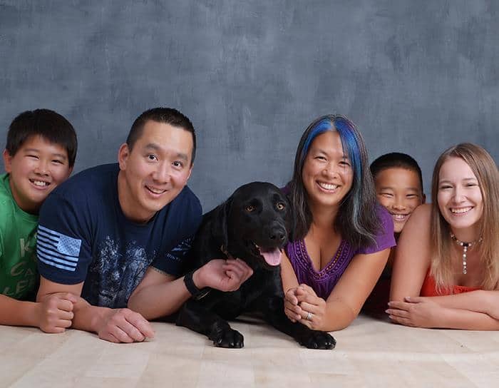 au pair, host family and dog portrait.